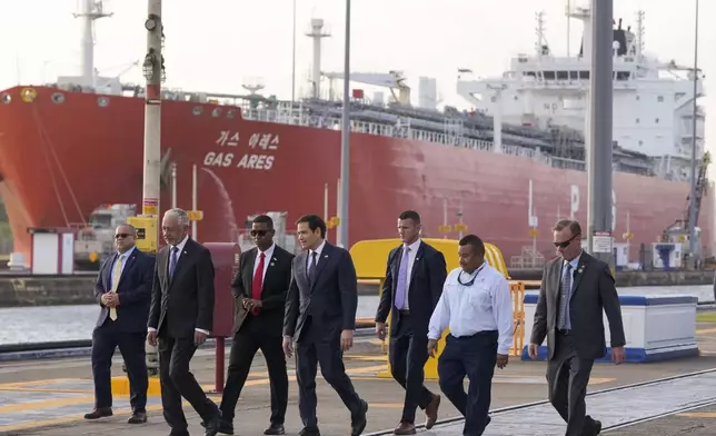 U.S. Secretary of State Marco Rubio, fourth from left, tours the Miraflores Locks at the Panama Canal in Panama City, Sunday, Feb. 2, 2025. (AP Photo/Mark Schiefelbein, Pool)