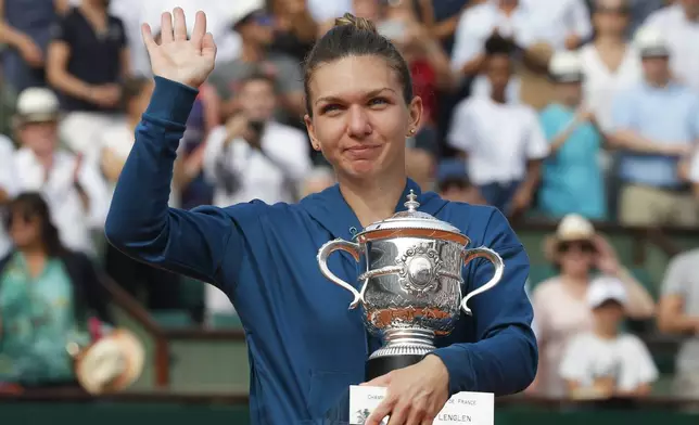 FILE - Romania's Simona Halep celebtrates with the trophy after defeating against Sloane Stephens, of the United States, in the finals of the French Open tennis tournament, Saturday, June 9, 2018, at the Roland Garros stadium in Paris, France. (AP Photo/Michel Euler, File)