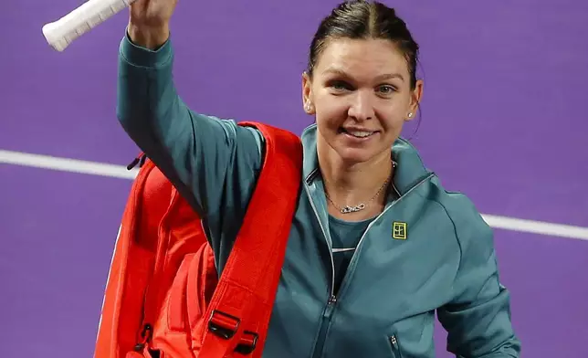 Romania's Simona Halep waves to fans after announcing her retirement from professional tennis following a defeat at the Transylvania Open women's tennis tournament, Tuesday, Feb. 4, 2025, in Cluj, Romania. (Mihaela-Ionela Bobar/Action Foto Romania via AP)