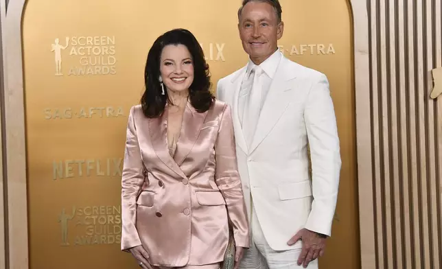 Fran Drescher, left, and Peter Marc Jacobson arrive at the 31st annual Screen Actors Guild Awards on Sunday, Feb. 23, 2025, at the Shrine Auditorium in Los Angeles. (Photo by Richard Shotwell/Invision/AP)