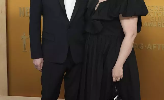 Gary Oldman, left, and Gisele Schmidt arrive at the 31st annual Screen Actors Guild Awards on Sunday, Feb. 23, 2025, at the Shrine Auditorium in Los Angeles. (Photo by Jordan Strauss/Invision/AP)