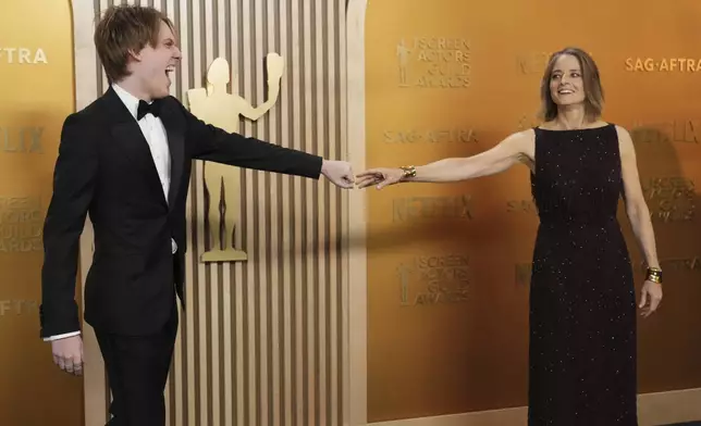Christopher "Kit" Bernard Foster, left, and Jodie Foster arrive at the 31st annual Screen Actors Guild Awards on Sunday, Feb. 23, 2025, at the Shrine Auditorium in Los Angeles. (Photo by Jordan Strauss/Invision/AP)