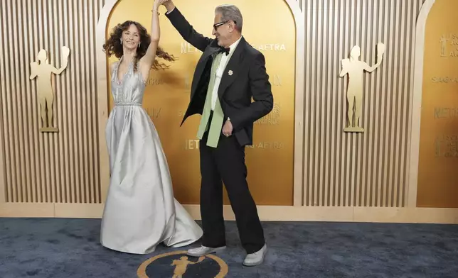 Emilie Livingston, left, and Jeff Goldblum arrive at the 31st annual Screen Actors Guild Awards on Sunday, Feb. 23, 2025, at the Shrine Auditorium in Los Angeles. (Photo by Jordan Strauss/Invision/AP)