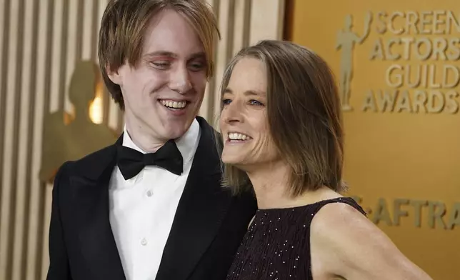 Christopher "Kit" Bernard Foster, left, and Jodie Foster arrive at the 31st annual Screen Actors Guild Awards on Sunday, Feb. 23, 2025, at the Shrine Auditorium in Los Angeles. (Photo by Jordan Strauss/Invision/AP)