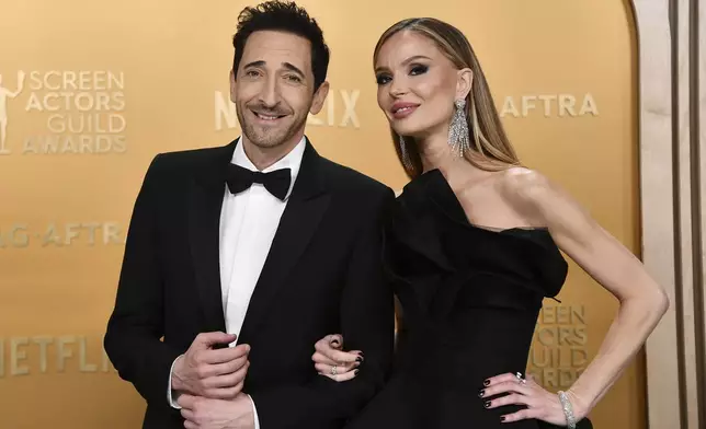 Adrien Brody, left, and Georgina Chapman arrive at the 31st annual Screen Actors Guild Awards on Sunday, Feb. 23, 2025, at the Shrine Auditorium in Los Angeles. (Photo by Richard Shotwell/Invision/AP)