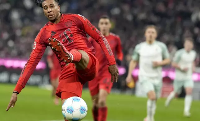 Bayern's Michael Olise in action during the German Bundesliga soccer match between Bayern Munich and Werder Bremen at the Allianz Arena in Munich, Germany, Friday, Feb. 7, 2025. (AP Photo/Matthias Schrader)