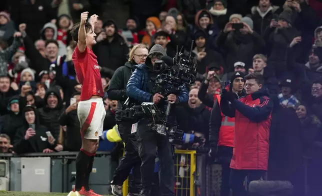 Manchester United's Harry Maguire celebrates after scoring his side's second goal during the English FA Cup fourth round soccer match between Manchester United and Leicester City at the Old Trafford stadium in Manchester, England, Friday, Feb. 7, 2025. (AP Photo/Dave Thompson)