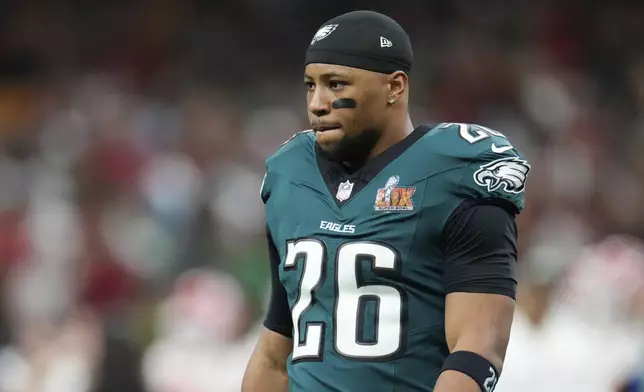 Philadelphia Eagles running back Saquon Barkley (26) walks on the field before the NFL Super Bowl 59 football game against the Kansas City Chiefs, Sunday, Feb. 9, 2025, in New Orleans. (AP Photo/George Walker IV)