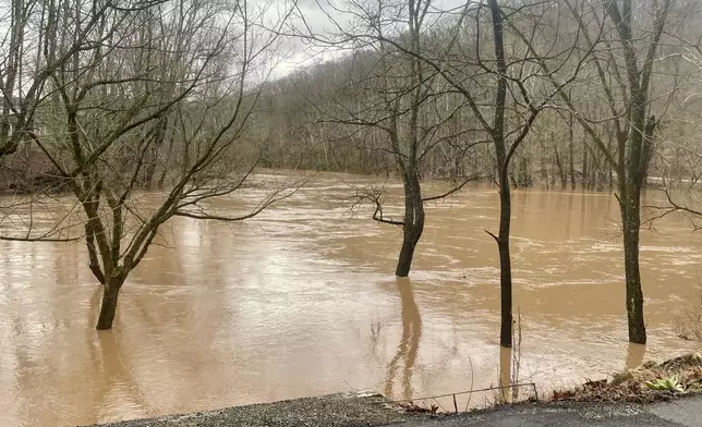 Flooding along the swollen Pocatalico River is shown Thursday, Feb. 6, 2025, in Poca, W.Va. (AP Photo/John Raby)
