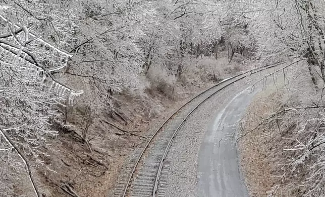 Trees covered in ice line the Great Allegheny Passage near Frostburg, Md., on Thursday, Feb. 6 2025. (Ken Nolan/Cumberland Times-News via AP)