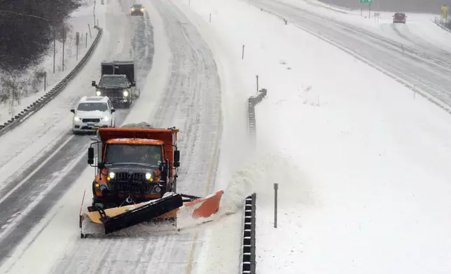 Dale West, a maintenance technician for the Vermont Agency of Transportation, Division 2 in Dummerston, Vt., plows the left lane of I-91 from Exit 3 to the Massachusetts state line during a snowstorm Thursday, Feb. 6, 2025. (Kristopher Radder/The Brattleboro Reformer via AP)