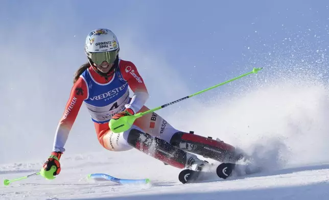 Switzerland's Camille Rast competes in a women's slalom, at the Alpine Ski World Championships, in Saalbach-Hinterglemm, Austria, Saturday, Feb. 15, 2025. (AP Photo/Giovanni Auletta)
