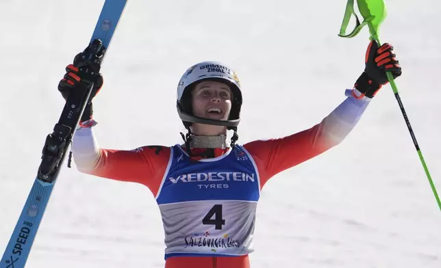 Switzerland's Camille Rast celebrates winning the gold medal in a women's slalom, at the Alpine Ski World Championships, in Saalbach-Hinterglemm, Austria, Saturday, Feb. 15, 2025. (AP Photo/Giovanni Auletta)
