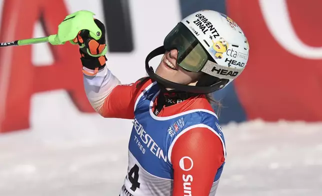 Switzerland's Camille Rast celebrates winning a women's slalom, at the Alpine Ski World Championships, in Saalbach-Hinterglemm, Austria, Saturday, Feb. 15, 2025. (AP Photo/Marco Trovati)