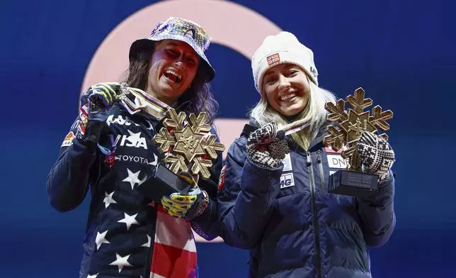 United States' Lauren Macuga, left, and Norway's Kajsa Vickhoff Lie show their joint bronze medals in a women's Super-G, at the Alpine Ski World Championships, in Saalbach-Hinterglemm, Austria, Thursday, Feb. 6, 2025. (AP Photo/Gabriele Facciotti)