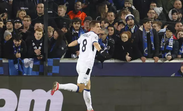 Atalanta's Mario Pasalic celebrates after scoring against Brugge during the Champions League playoff first leg soccer match between Club Brugge and Atalanta at the Jan Breydel Stadium in Bruges, Belgium, Wednesday, Feb. 12, 2025. (AP Photo/Geert Vanden Wijngaert)