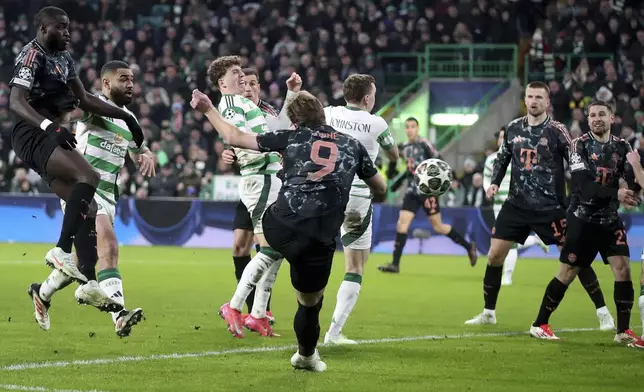 Bayern's Harry Kane scores his side's second goal during the Champions League play off first leg soccer match between Celtic Glasgow and Bayern Munich at the Celtic Park Stadium in Glasgow, Scotland, Wednesday, Feb. 12, 2025. (AP Photo/Scott Heppell)