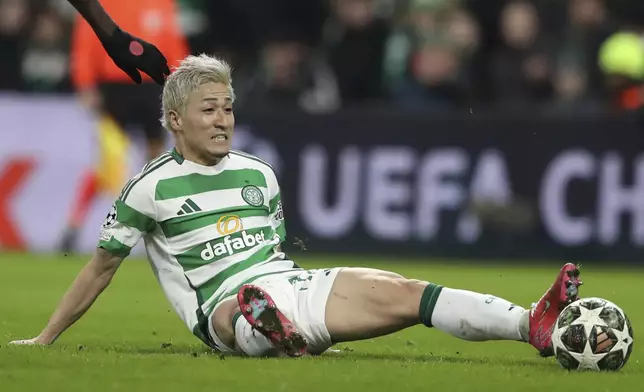 Celtic's Daizen Maeda sits on the ground during the Champions League play off first leg soccer match between Celtic Glasgow and Bayern Munich at the Celtic Park Stadium in Glasgow, Scotland, Wednesday, Feb. 12, 2025. (AP Photo/Scott Heppell)
