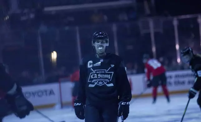 Team Black player singer Justin Bieber skates during the Skate for LA Strong celebrity hockey game, Sunday, Feb. 23, 2025, in Los Angeles. (AP Photo/Eric Thayer)