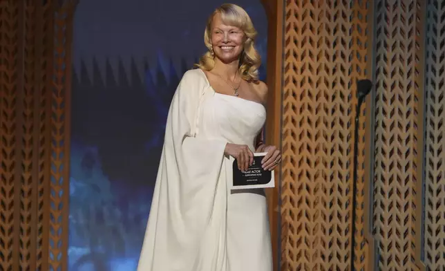 Pamela Anderson presents the award for outstanding performance by a male actor in a supporting role during the 31st annual Screen Actors Guild Awards on Sunday, Feb. 23, 2025, at the Shrine Auditorium in Los Angeles. (AP Photo/Chris Pizzello)