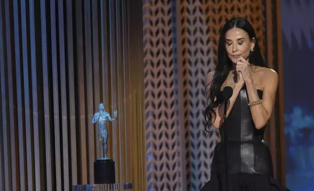 Demi Moore accepts the award for outstanding performance by a female actor in a leading role for "The Substance" during the 31st annual Screen Actors Guild Awards on Sunday, Feb. 23, 2025, at the Shrine Auditorium in Los Angeles. (AP Photo/Chris Pizzello)