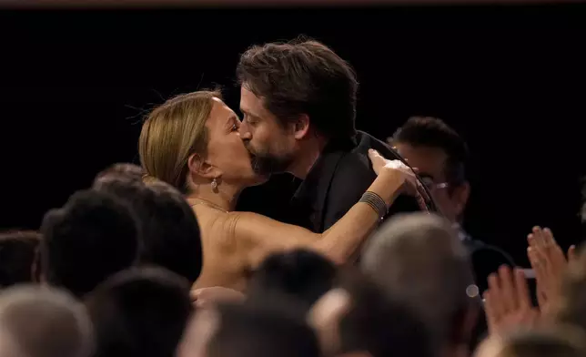 Kieran Culkin, right, winner of the award for outstanding performance by a male actor in a supporting role for "A Real Pain," embraces his mother Patricia Brentrup during the 31st annual Screen Actors Guild Awards on Sunday, Feb. 23, 2025, at the Shrine Auditorium in Los Angeles. (AP Photo/Chris Pizzello)