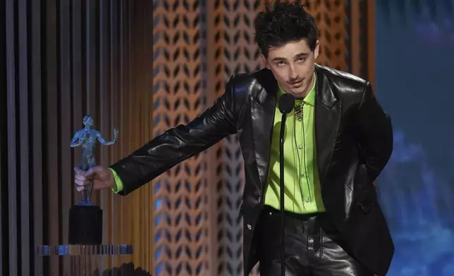 Timothee Chalamet accepts the award for outstanding performance by a male actor in a leading role for "A Complete Unknown" during the 31st annual Screen Actors Guild Awards on Sunday, Feb. 23, 2025, at the Shrine Auditorium in Los Angeles. (AP Photo/Chris Pizzello)