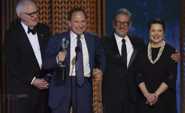 John Lithgow, from left, Ralph Fiennes, Sergio Castellitto, and Isabella Rossellini accepts the award for outstanding performance by a cast in a motion picture for "Conclave" during the 31st annual Screen Actors Guild Awards on Sunday, Feb. 23, 2025, at the Shrine Auditorium in Los Angeles. (AP Photo/Chris Pizzello)