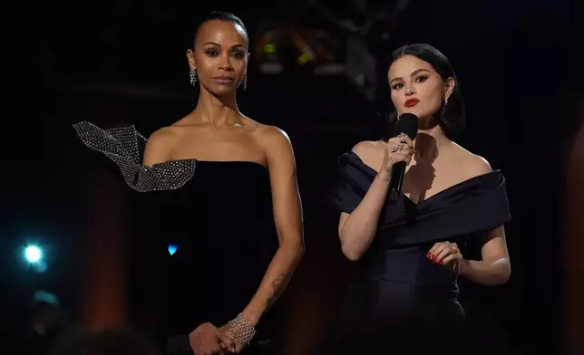 Zoe Saldana, left, and Selena Gomez speaks about "Emilia Perez" during the 31st annual Screen Actors Guild Awards on Sunday, Feb. 23, 2025, at the Shrine Auditorium in Los Angeles. (AP Photo/Chris Pizzello)