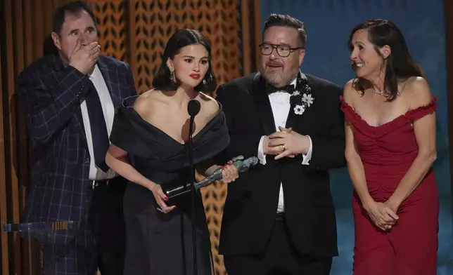 Richard Kind, from left, Selena Gomez, Michael Cyril Creighton, and Molly Shannon accept the award for outstanding performance by an ensemble in a comedy series for "Only Murders In The Building" during the 31st annual Screen Actors Guild Awards on Sunday, Feb. 23, 2025, at the Shrine Auditorium in Los Angeles. (AP Photo/Chris Pizzello)