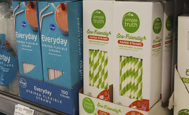 Plastic straws, left, sit next to paper straws on display for sale in Cincinnati on Tuesday, Feb. 11, 2025. (AP Photo/Joshua A. Bickel)