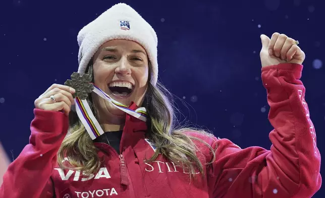 United States' Paula Moltzan shows her bronze medal for a women's giant slalom, at the Alpine Ski World Championships, in Saalbach-Hinterglemm, Austria, Thursday, Feb. 13, 2025. (AP Photo/Giovanni Auletta)