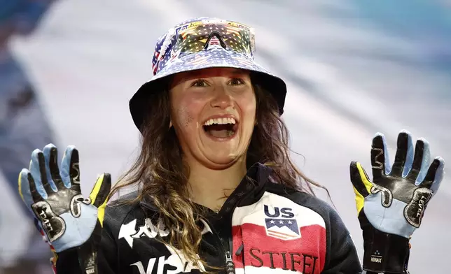 United States' Lauren Macuga celebrates moments before being given a bronze medal for a women's Super-G, at the Alpine Ski World Championships, in Saalbach-Hinterglemm, Austria, Thursday, Feb. 6, 2025. (AP Photo/Gabriele Facciotti)