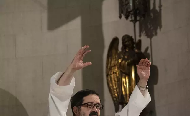 Priest Miguel Moreyra leads a Mass to pray for Pope Francis' health in Buenos Aires, Argentina, Wednesday, Feb. 19, 2025. (AP Photo/Rodrigo Abd)
