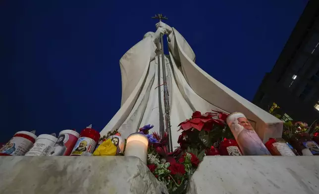 A statue of Pope John Paul II is seen in front of the Agostino Gemelli Polyclinic, Rome, Wednesday, Feb. 19, 2025, where the Pontiff is hospitalized since Friday, Feb. 14. (AP Photo/Andrew Medichini)