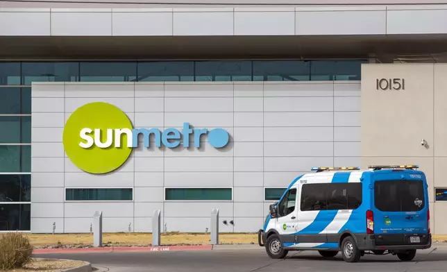 A van drives into Sun Metro Bicentennial Council Transit Operations Center on Tuesday, Feb. 11, 2025, in El Paso, Texas. (AP Photo/Andres Leighton)