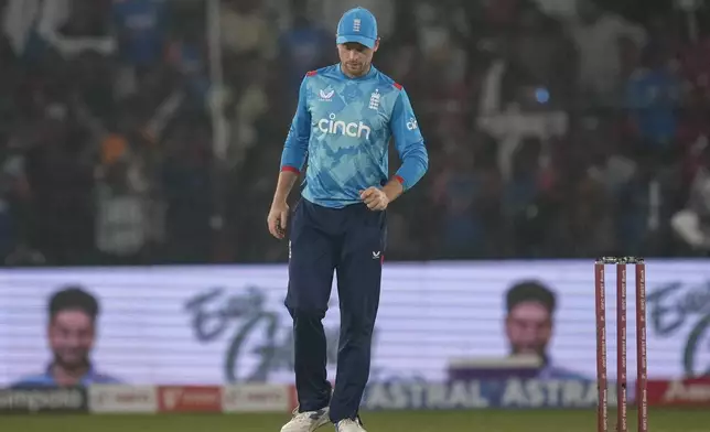 England's captain Jos Buttler leaves the field after his side lost the second one day international cricket match against India in Cuttack, India, Sunday, Feb. 9, 2025. (AP Photo/Rafiq Maqbool)