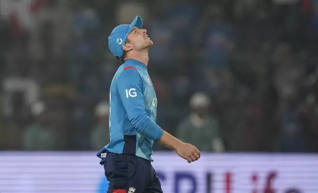 England's captain Jos Buttler leaves the field after his side lost the second one day international cricket match against India in Cuttack, India, Sunday, Feb. 9, 2025. (AP Photo/Rafiq Maqbool)