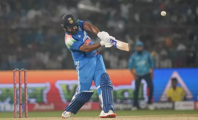 India's captain Rohit Sharma plays a shot during the second one day international cricket match between India and England in Cuttack, India, Sunday, Feb. 9, 2025. (AP Photo/Rafiq Maqbool)