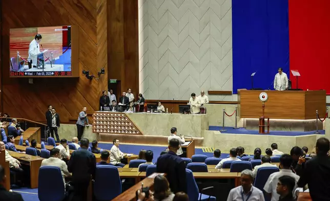 House Speaker Martin Romualdez, top right, presides over the impeachment proceedings against Vice President Sara Duterte at the House of Representatives in Quezon City in Manila, Philippines, Wednesday, Feb.5, 2025. (AP Photo/Gerard Carreon)