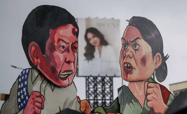 FILE- An effigy of Philippine President Ferdinand Marcos Jr. and Vice President Sara Duterte are displayed during a rally ahead of the third State of the Nation Address by the president in Quezon City, Philippines, Monday, July 22, 2024. (AP Photo/Mark Cristino, File)
