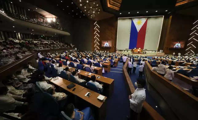 FILE- Lawmakers listen as new Philippine President Ferdinand Marcos Jr. delivers his first state of the nation address in, Quezon city, Philippines, Monday, July 25, 2022. (AP Photo/Aaron Favila, File)
