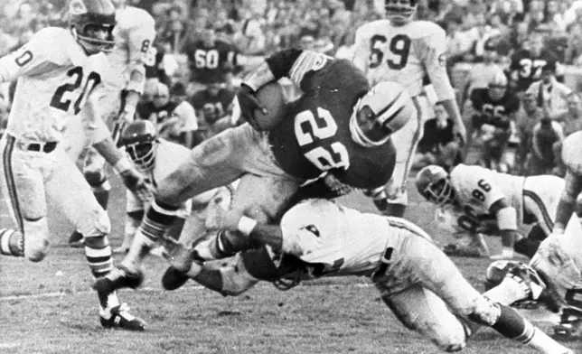 FILE - In this Jan. 15, 1967, file photo, Green Bay Packers' Klijah Pitts (22) goes over right tackle to the Kansas City Chiefs' five-yard line, for a six-yard gain before being brought down by Kansas City's Johnny Robinson in the fourth quarter of Super Bowl I in Los Angeles. (AP Photo/File)