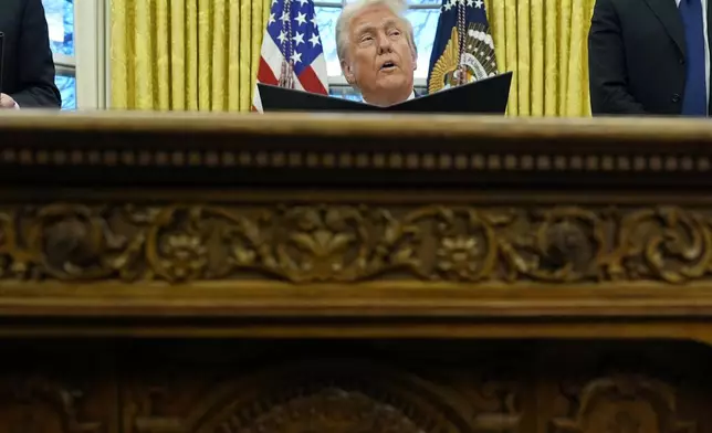 President Donald Trump speaks with reporters as he signs an executive order in the Oval Office at the White House, Monday, Feb. 10, 2025, in Washington. (Photo/Alex Brandon)