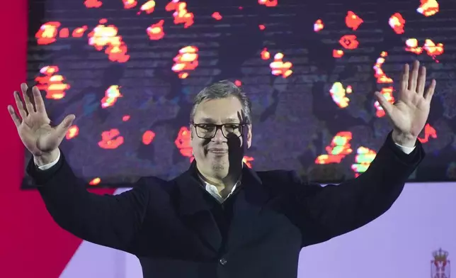 Serbian President Aleksandar Vucic waves to his supporters during a rally marking the country's Statehood Day in Sremska Mitrovica, Serbia, Saturday, Feb. 15, 2025. (AP Photo/Antonio Ahel)