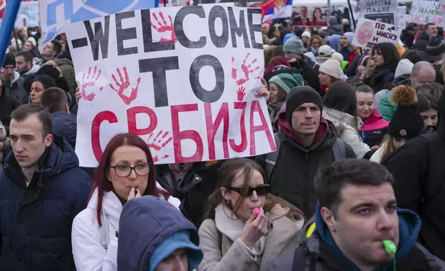 People hold banner that reads: "Welcome to Serbia" during a protest triggered after a concrete canopy on a railway station in the northern city of Novi Sad collapsed on Nov. 1, 2024 killed 15 people, in Kragujevac, Serbia, Saturday, Feb. 15, 2025. (AP Photo/Darko Vojinovic)