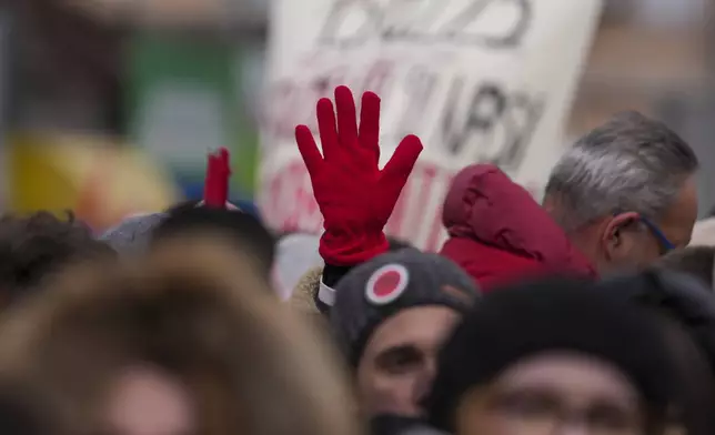 People attend a protest triggered after a concrete canopy on a railway station in the northern city of Novi Sad collapsed on Nov. 1, 2024 killed 15 people, in Kragujevac, Serbia, Saturday, Feb. 15, 2025. (AP Photo/Darko Vojinovic)