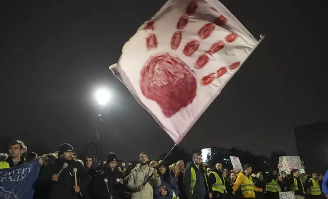 Residents welcome students in the Serbian industrial town of Kragujevac, who have arrived to protest the deaths of 15 people killed in the November collapse of a train station canopy, Friday, Feb. 14, 2025. (AP Photo/Darko Vojinovic)