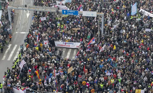 People attend a protest triggered after a concrete canopy on a railway station in the northern city of Novi Sad collapsed on Nov. 1, 2024 killed 15 people, in Kragujevac, Serbia, Saturday, Feb. 15, 2025. (AP Photo/Marko Drobnjakovic)
