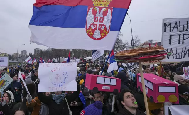 People shout slogans during a student-led large protest and a 15-hour blockade of the streets in Serbian industrial town of Kragujevac, to protest the deaths of 15 people killed in the November collapse of a train station canopy, Saturday, Feb. 15, 2025. (AP Photo/Darko Vojinovic)